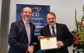 Dr Gabriel-Miro Muntean, School of Electronic Engineering, receiving his Research Award from Prof. Brian MacCraith, President of DCU.