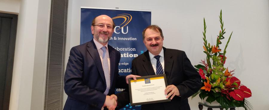 Dr Gabriel-Miro Muntean, School of Electronic Engineering, receiving his Research Award from Prof. Brian MacCraith, President of DCU.